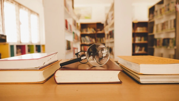 book-library-with-old-open-textbook-stack-piles-literature-text-archive-reading-desk